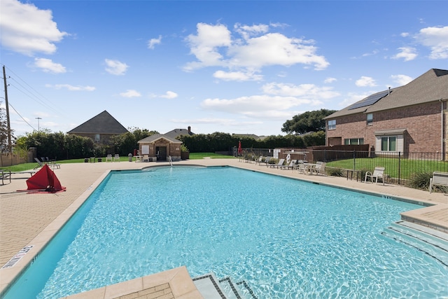 view of swimming pool featuring a patio area