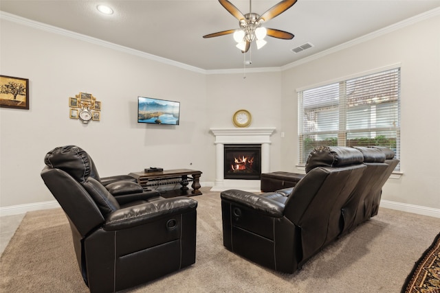 living room featuring crown molding, light colored carpet, and ceiling fan