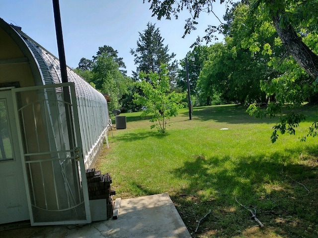 view of yard featuring central air condition unit