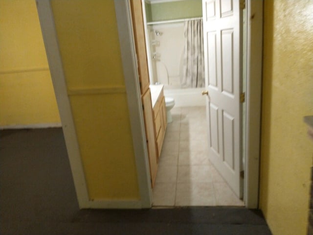 hallway featuring light tile patterned floors