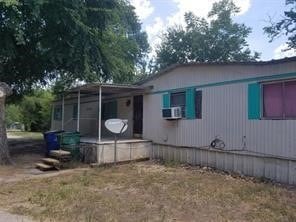 view of home's exterior with cooling unit