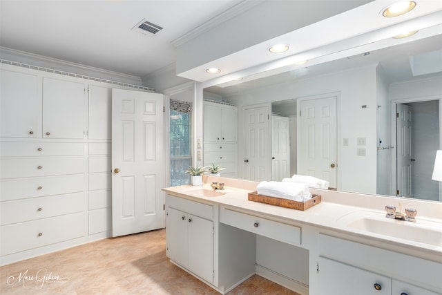 bathroom with vanity and crown molding