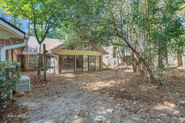 view of yard with a sunroom