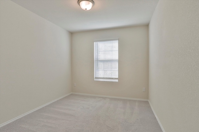 empty room with light colored carpet