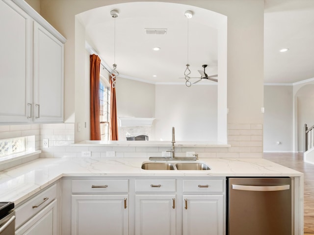 kitchen with ceiling fan, sink, stainless steel dishwasher, pendant lighting, and white cabinets