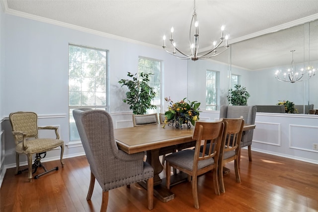 dining area featuring ornamental molding and wood-type flooring