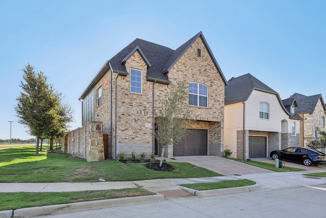 view of front of house featuring a front lawn and a garage