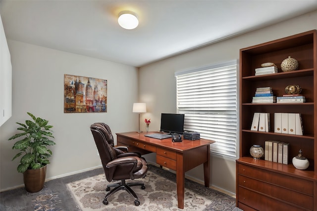 office with dark colored carpet