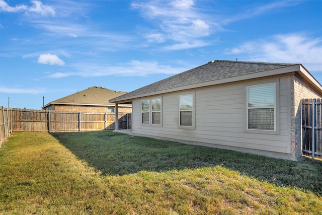 back of house with a yard