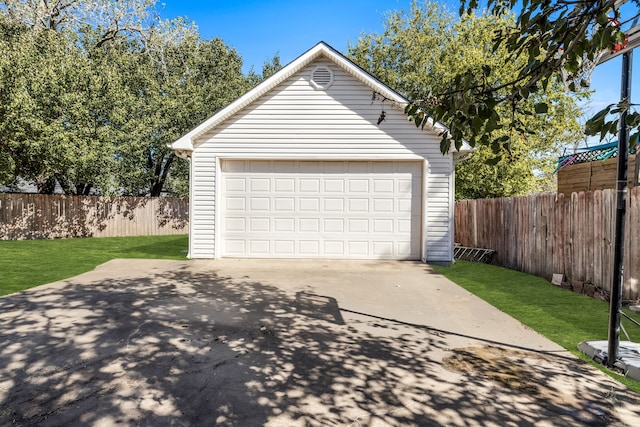 garage featuring a yard