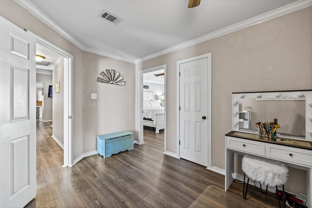 interior space with dark wood-type flooring and ornamental molding