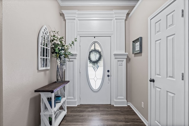 foyer with ornamental molding and dark hardwood / wood-style flooring