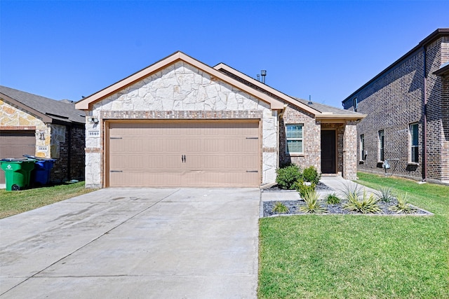 view of front facade with a front yard and a garage