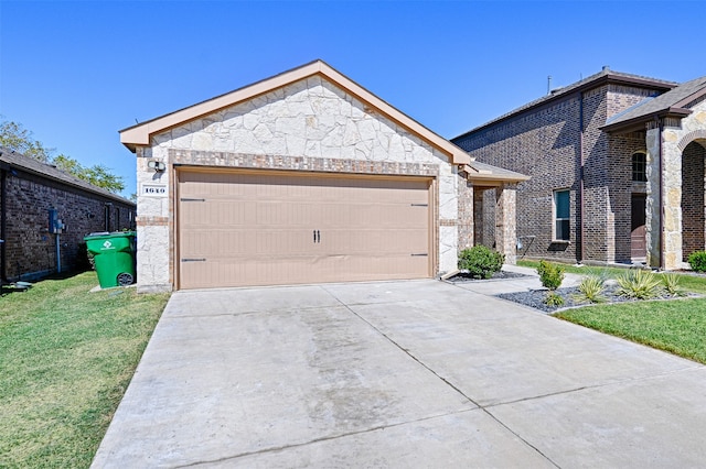 view of front of home with a front yard and a garage