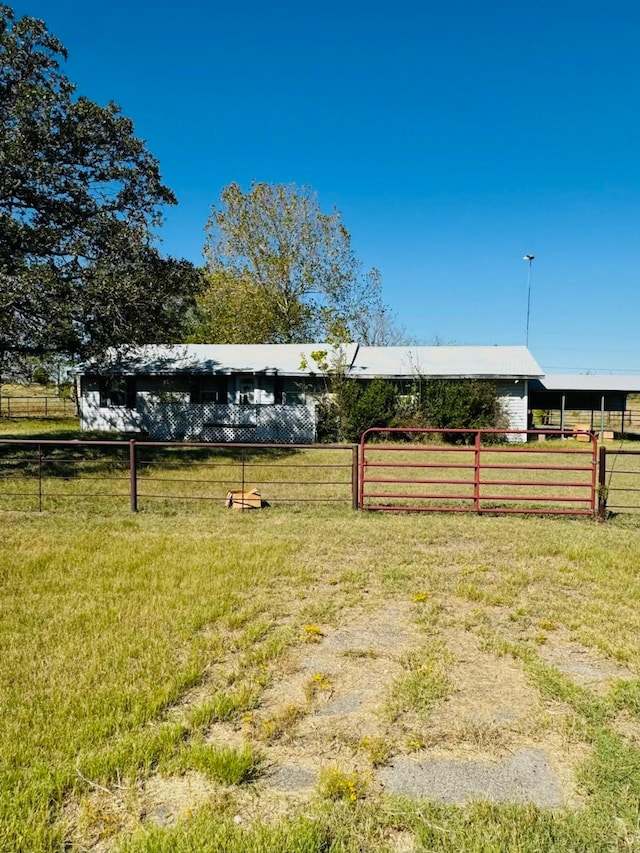 view of yard with a rural view