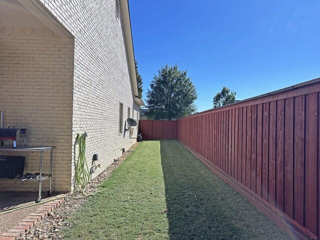 view of home's exterior with a balcony and a garage