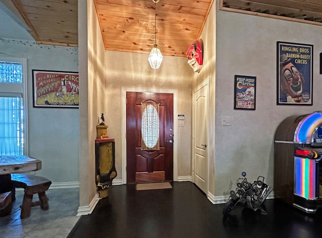 foyer entrance featuring wood ceiling