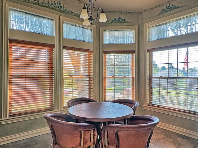 dining space with a chandelier