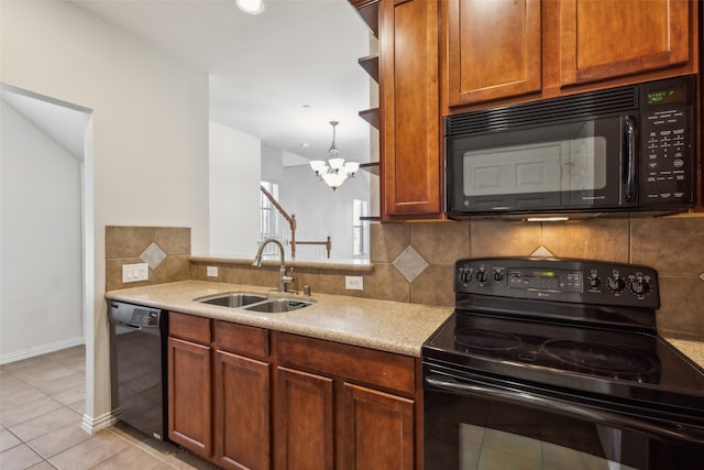 kitchen featuring decorative backsplash, sink, black appliances, light tile patterned floors, and a chandelier