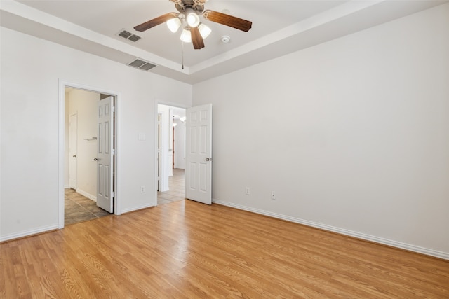 unfurnished bedroom with light hardwood / wood-style flooring and ceiling fan