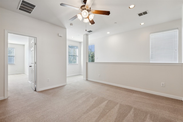 carpeted empty room with ceiling fan