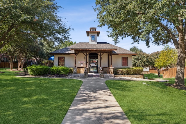 view of front facade with a front yard and a porch