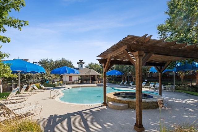 view of swimming pool with a patio area and a community hot tub