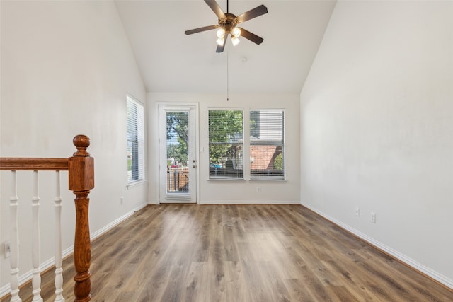 interior space with ceiling fan, high vaulted ceiling, and hardwood / wood-style floors