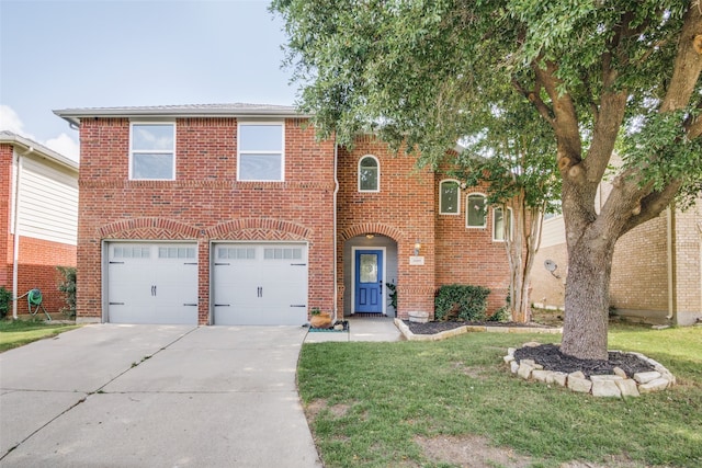 view of front facade featuring a front yard and a garage