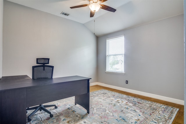 living room featuring light carpet, lofted ceiling, and ceiling fan