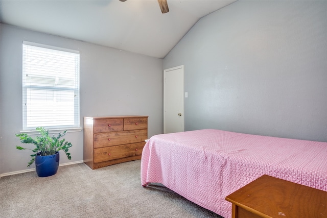 carpeted empty room featuring lofted ceiling and ceiling fan