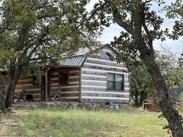 view of home's exterior featuring an outdoor structure