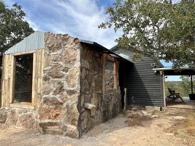 view of property exterior featuring an outbuilding