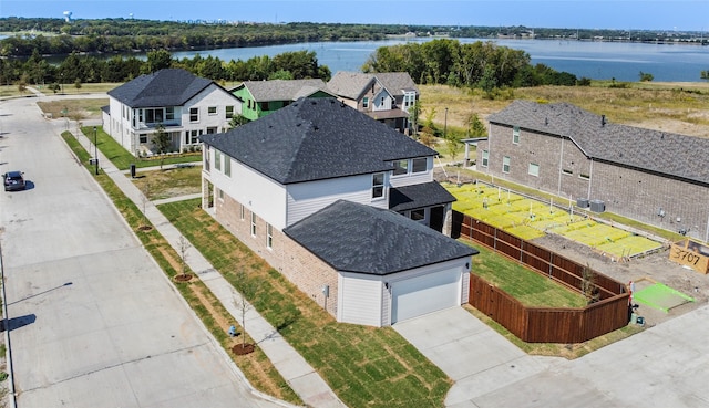 birds eye view of property with a water view