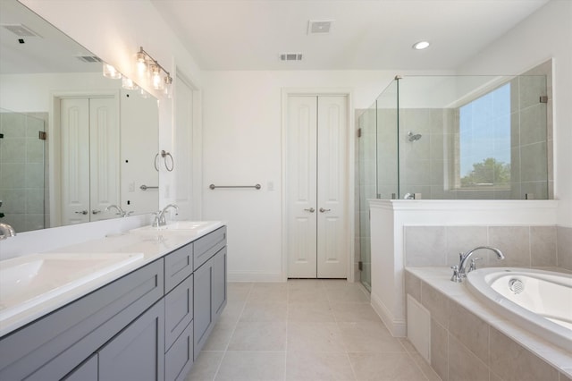 bathroom with vanity, tile patterned floors, and separate shower and tub