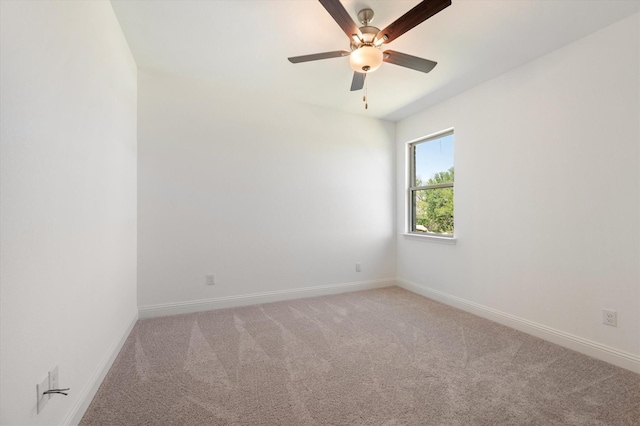 empty room featuring carpet and ceiling fan