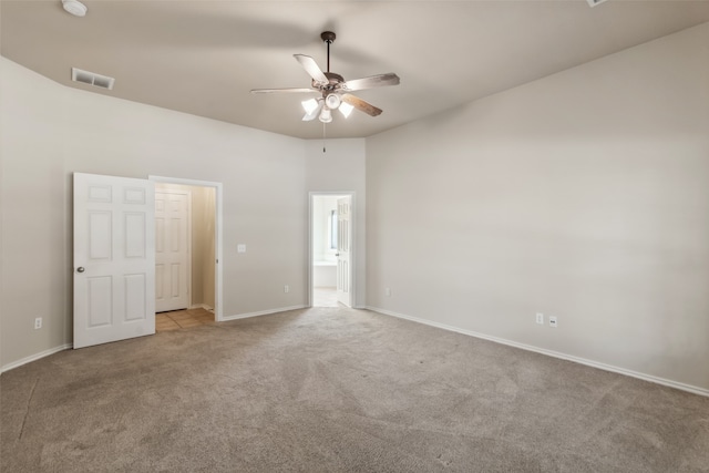 empty room featuring light carpet and ceiling fan