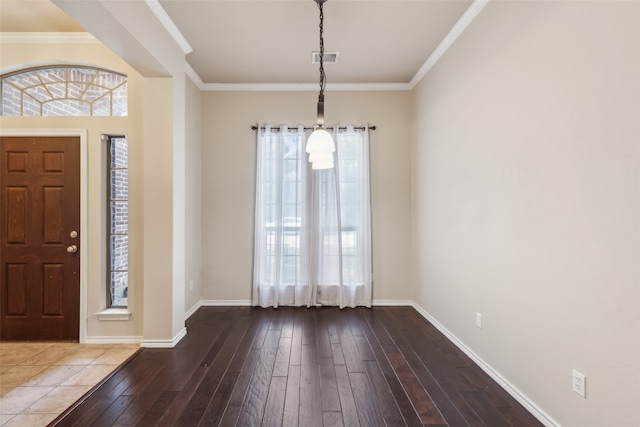 foyer entrance featuring crown molding and wood-type flooring