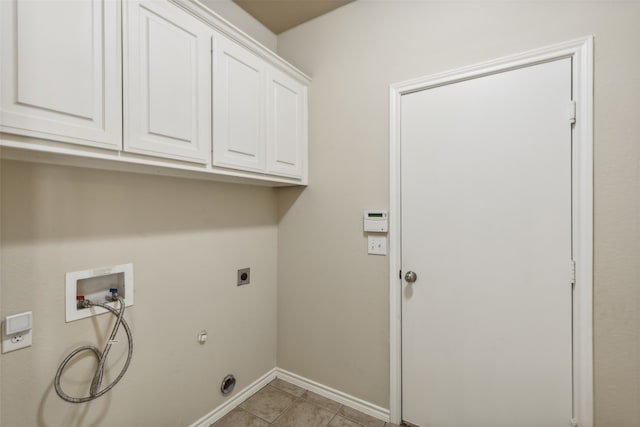 laundry room with cabinets, washer hookup, gas dryer hookup, light tile patterned flooring, and electric dryer hookup