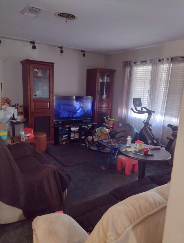 living room featuring dark tile patterned floors