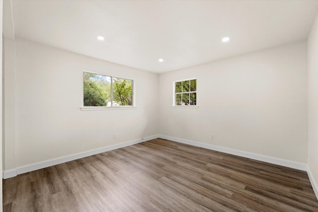 spare room with hardwood / wood-style floors