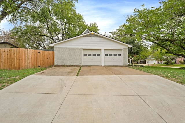 garage featuring a lawn