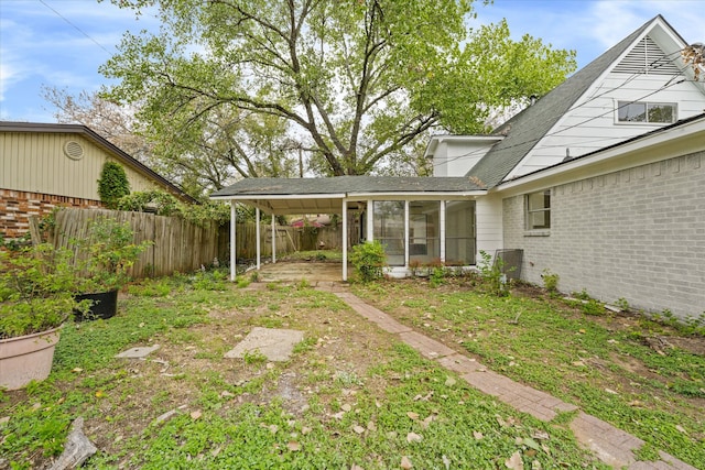 view of yard with a sunroom