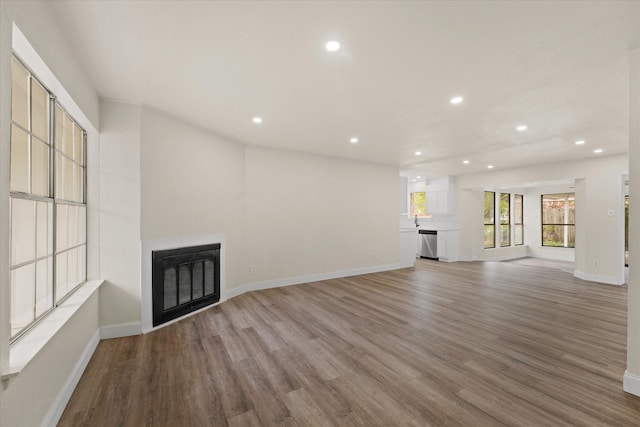 unfurnished living room featuring light hardwood / wood-style flooring