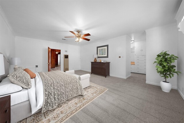 carpeted bedroom featuring ceiling fan and ornamental molding