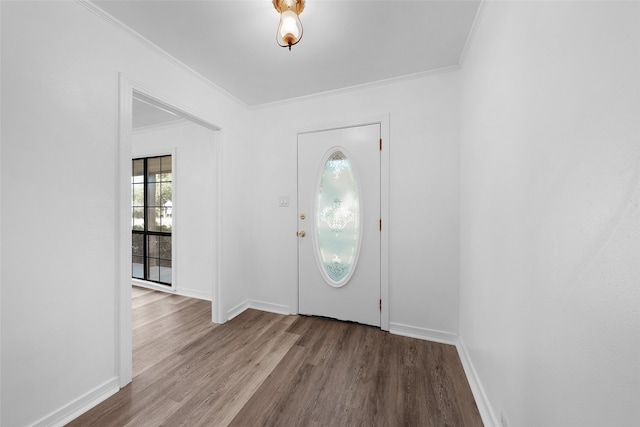 foyer featuring light hardwood / wood-style flooring and crown molding