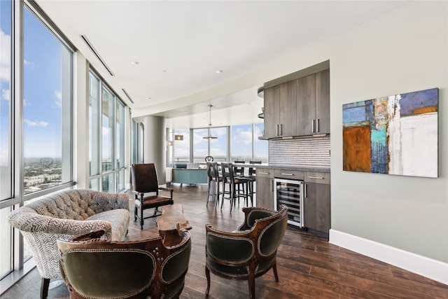 interior space featuring wine cooler, dark hardwood / wood-style flooring, and a wall of windows