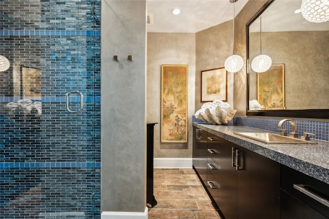 bathroom featuring vanity and decorative backsplash