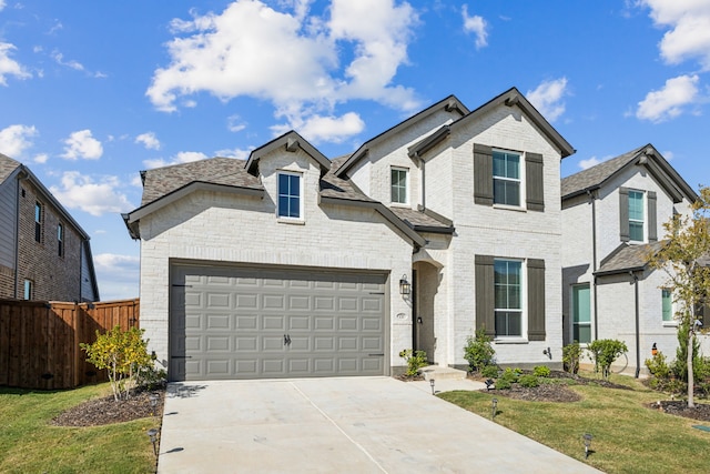 french country inspired facade featuring a front lawn