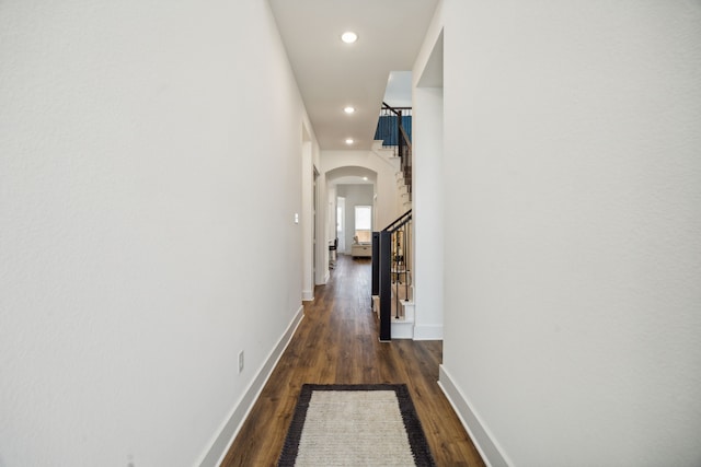 hallway featuring dark wood-type flooring